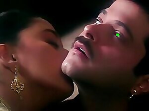 Sensual encounter between Anil and Madhuri in a romantic Gujarati-themed setting. Passionate kissing and intimate moments.